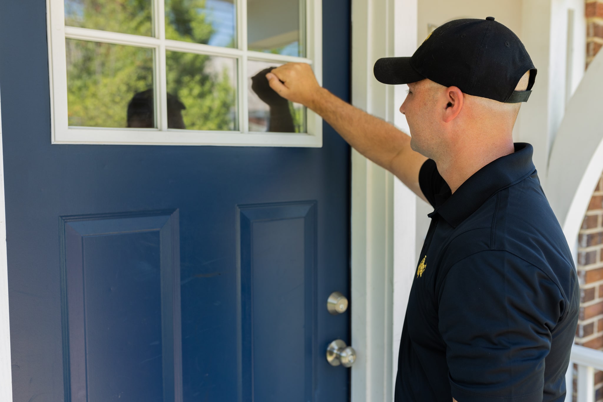 Critter Control salesperson technician knocking at door
