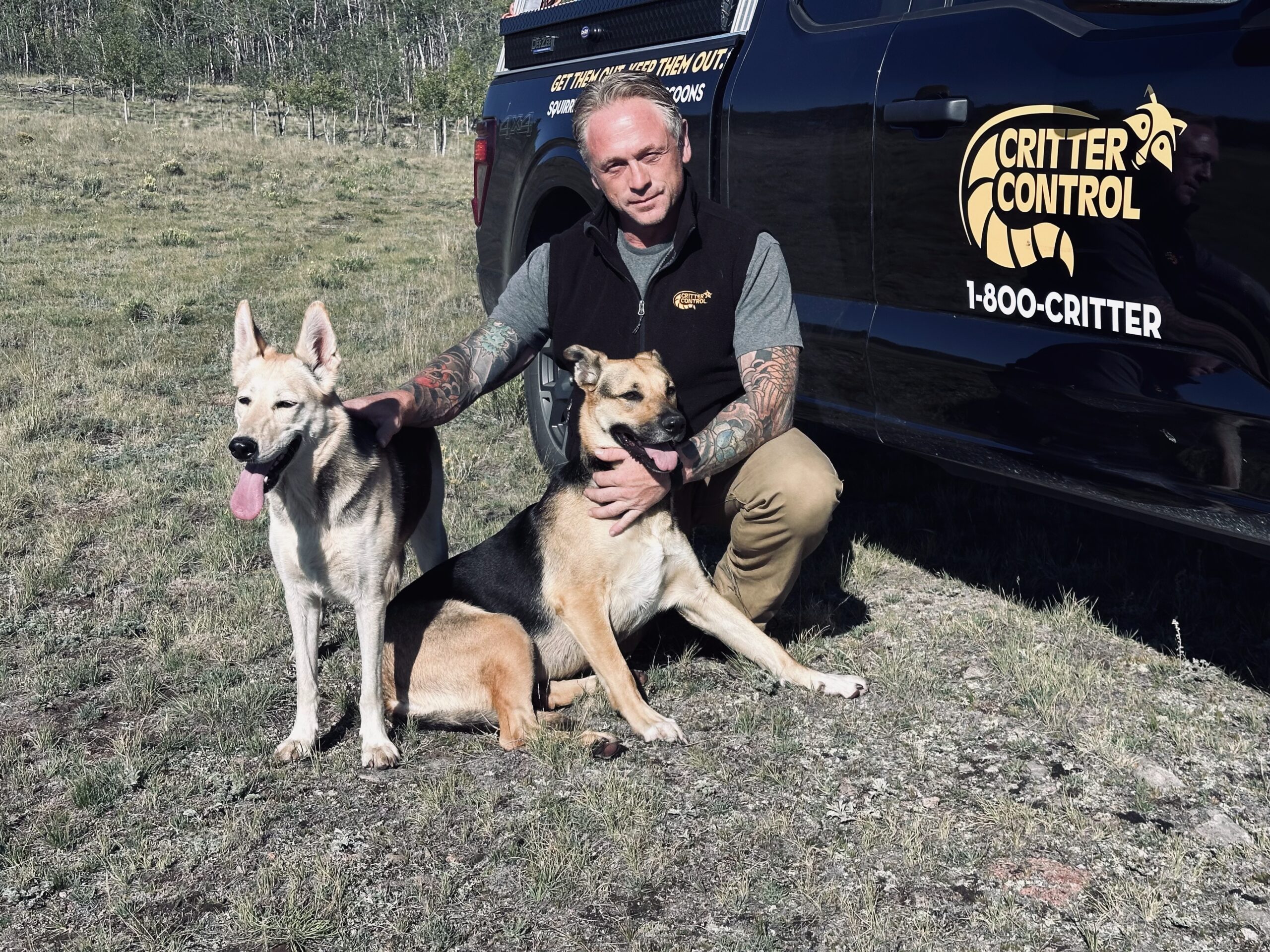 Michael Burton with dogs Critter Control of Fort Collins